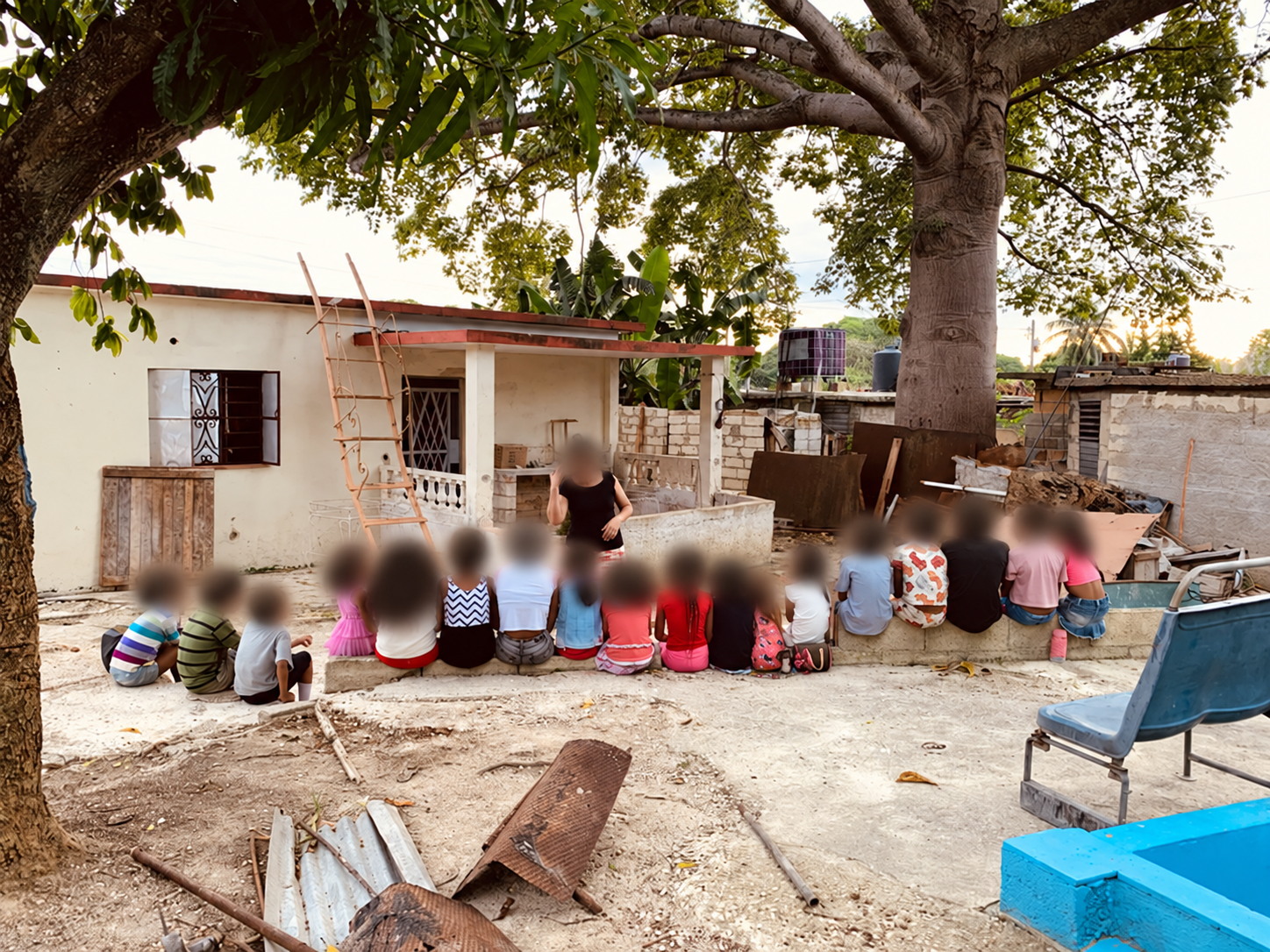 A group gathered outdoors, with faces blurred for privacy